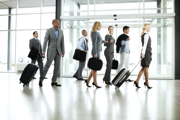 Large group of multiethnic business people walking at corridor.